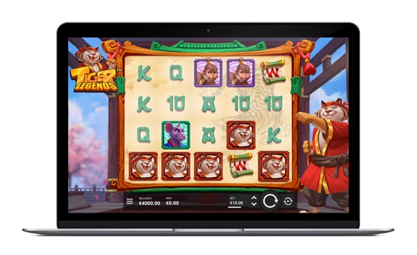 Pantalla de la tragamonedas Tiger Legends de Hacksaw Gaming con dojo de madera, pérgola florida y guerreros-animal sensei
